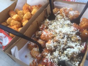 Regular Tots along with the Tots smothered in green chile and some light cojita sprinkles